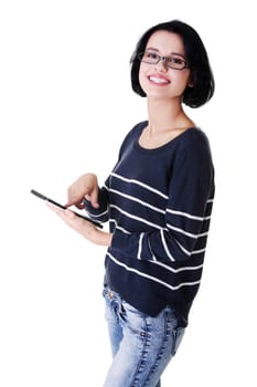 Young pretty woman working on tablet computer, isolated on white