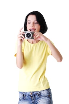Close-up of a young woman photographer doing photo