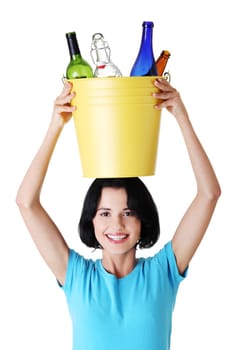 Beautiful young woman holding recycling bin isolated on white background.