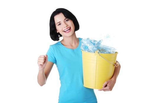 Beautiful young woman holding recycling bin isolated on white background.