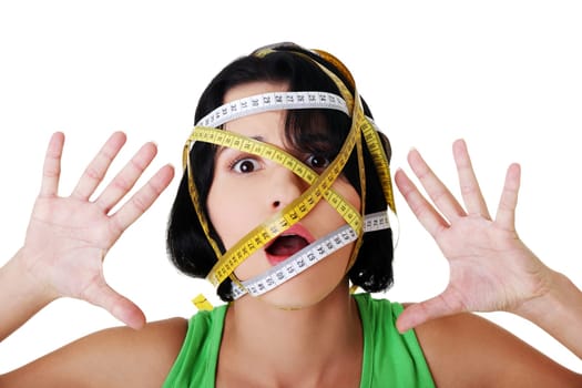 Beautiful young caucasian woman with measuring tape around her head