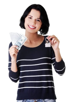 Beautiful young woman holding US dollars bills and house model over white - real estate loan concept