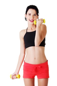 Fitness girl is working out with dumbbells , isolated on white background