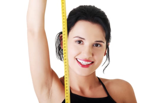 Pretty smiling woman holding measurement type - isolated on white