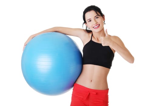 Beautiful young healthy lifestyle woman with pilates exercise ball.