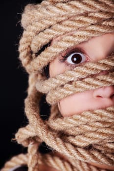 Tied up scared woman face. Violence concept.