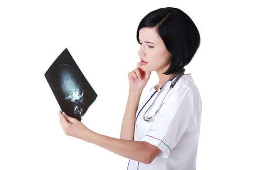 Female doctor or nurse looking at radiography photo , isolated on white