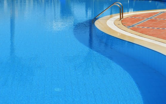 Swimming pool in touristic resort during summer time