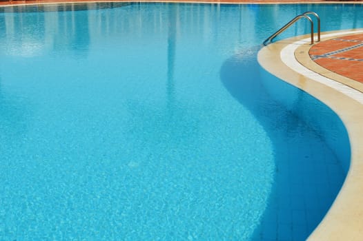 Swimming pool in touristic resort during summer time
