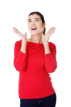 Shocked woman looking up, isolated on white