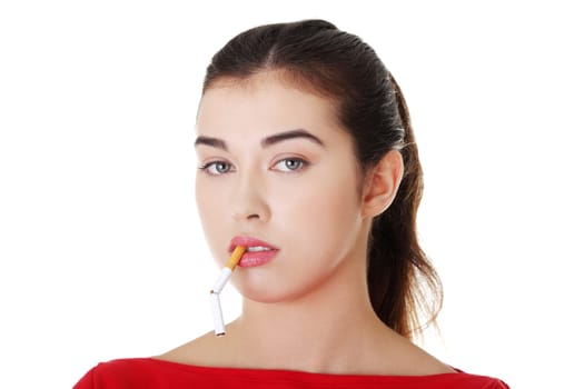 Young woman with broken cigarette. Stop smoking concept.