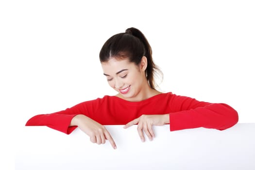 Portrait young happy woman with blank board , isolated on white
