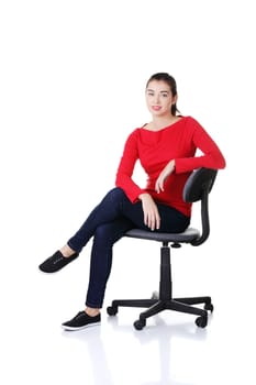 Young happy student woman or businesswoman sitting on a wheel chair, isolated over a white background