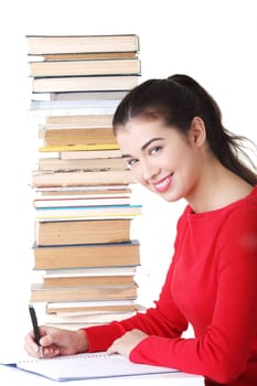 Happy smiling young student woman with books, isolated on white background
