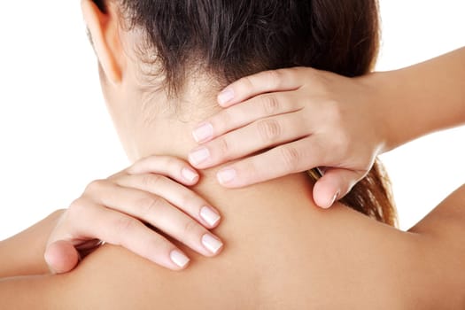 Young woman with pain in her back. Isolated on white