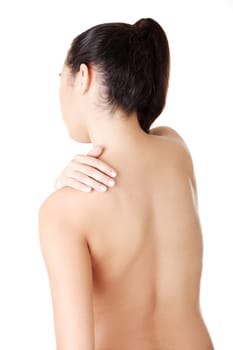 Young woman with pain in her back. Isolated