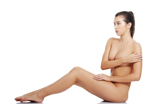 Sexy fit naked woman with healthy clean skin, isolated on white background