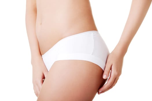 Slim tanned woman's body. Isolated over white background.