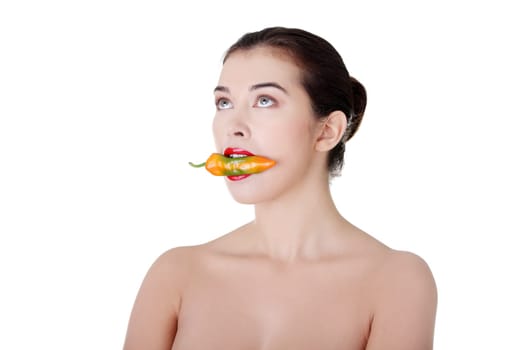 Beautiful woman with hot paprika, isolated on white