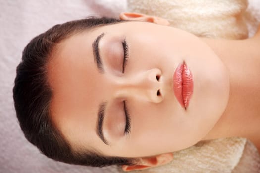 Beauty young woman relaxing in spa.