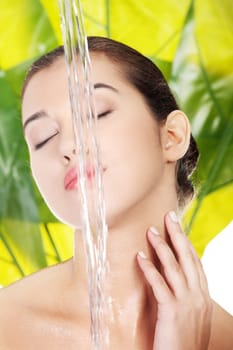 Portrait of beautiful clean face of woman under the stream of water