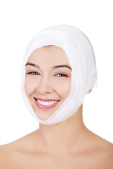 Portrait of beautiful young female face with bandage - beauty treatment plastic surgery
