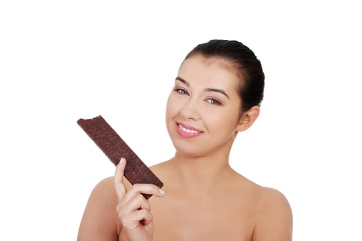 Pretty happy smiling woman eating chocolate waffle, isolated on white