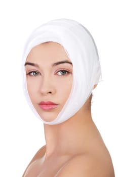 Portrait of beautiful young female face with bandage - beauty treatment plastic surgery
