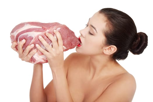 Young beautiful woman eating raw meat. Isolated on white