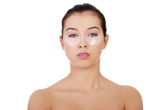 Young beautiful woman with collagen eye lift mask, isolated on white.