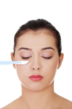 Cosmetic surgery concept. Female face in background of scalpel.