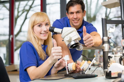 Dental technician at work in a dental laboratory or dental workshop