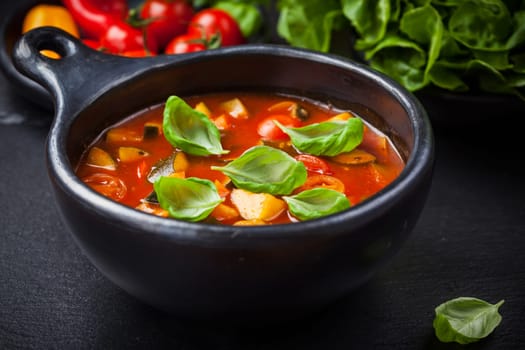 Homemade delicious minestrone soup with basil