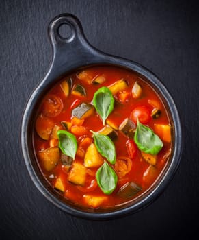 Homemade delicious minestrone soup with basil