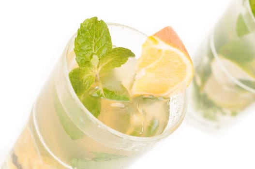 Mojito a Cuban cocktail made with cuban rum, lime, sugar , a splash of soda and flavoured with fresh fruit of your choice