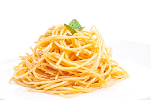 Plain spaghetti tossed in olive oil and decorated with fresh basil