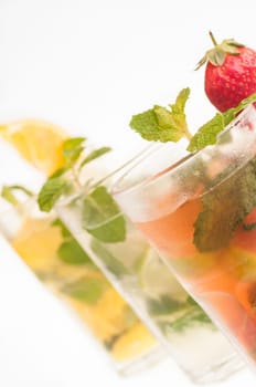 Mojito a Cuban cocktail made with cuban rum, lime, sugar , a splash of soda and flavoured with fresh fruit of your choice