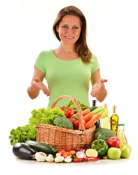 Young woman with variety of vegetables isolated on white background