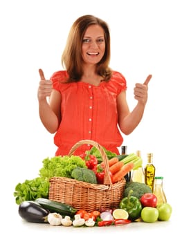 Young woman with variety of vegetables isolated on white background