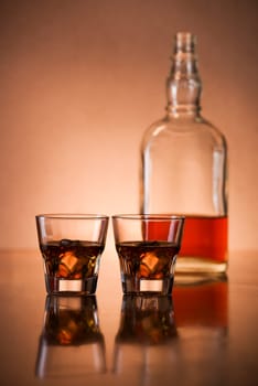 Glasses of fine whiskey on counter close up