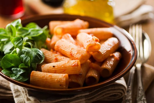 Macaroni pasta with tomato sauce close up