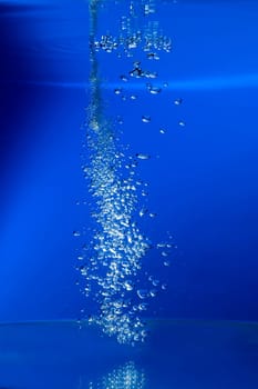 water bubbles on blue background close up