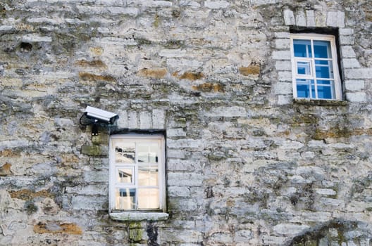 The chamber of video observation on a wall of a building near a window