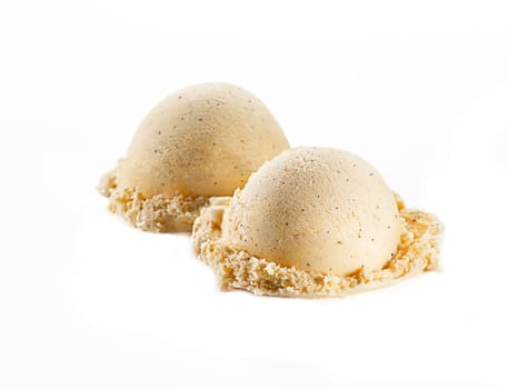 Vanilla ice cream scoops with seeds isolated on white