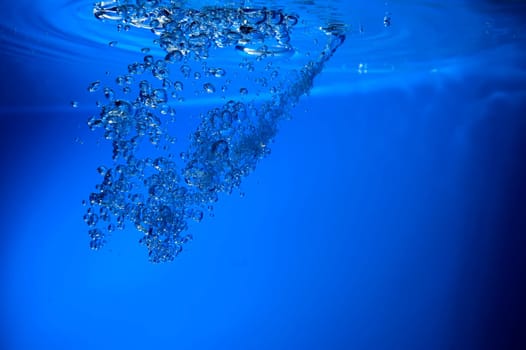 water bubbles on blue background close up