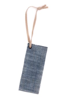 Blank denim label with rough rope. Isolate on white.