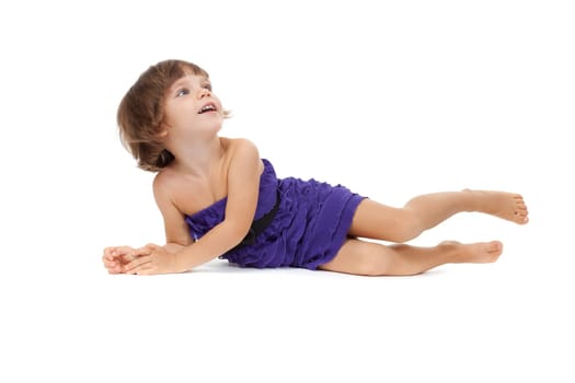 Cute girl lying on the floor - isolated over a white background