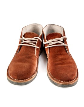 a pair of brown suede shoes isolated on white background
