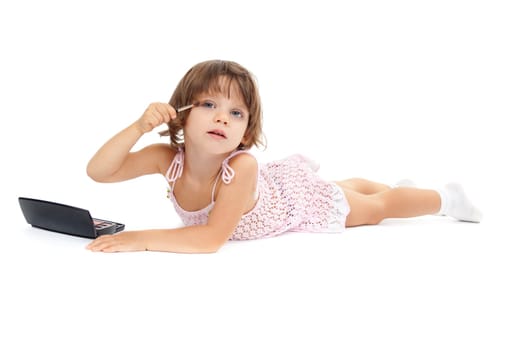 beautiful little girl paints the eyelashes mascara. Isolated on white background