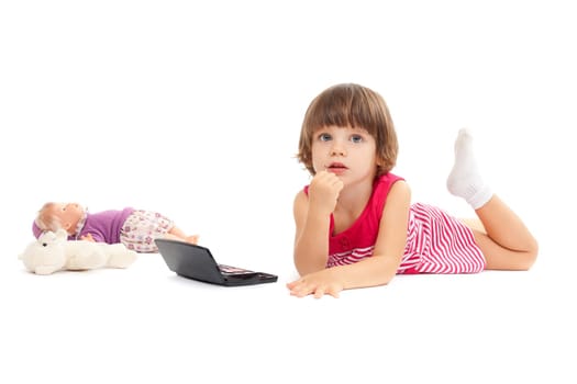 Little beautiful girl is playing with make-up over white background